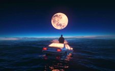 Man sitting on car floating in the ocean
