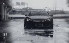 Black Sports Car in the Wet Streets