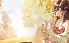 girl with book in autumn