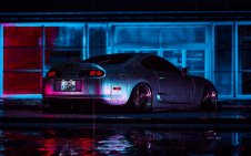 TOYOTA SUPRA at neon night  under the rain