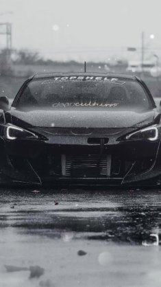 black sports car in the wet streets live wallpaper