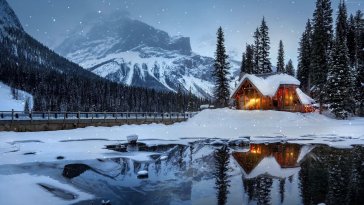 cabin in winter by a lake live wallpaper